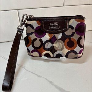 Coach Wristlet in a colorful logo pattern and compact size with hang tag EUC